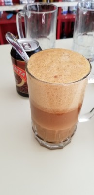 Stout beer mixed with condensed milk